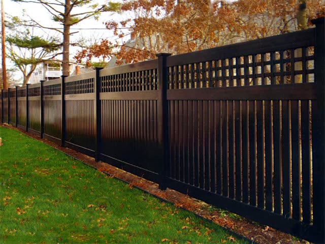 Black PVC fence along a yard
